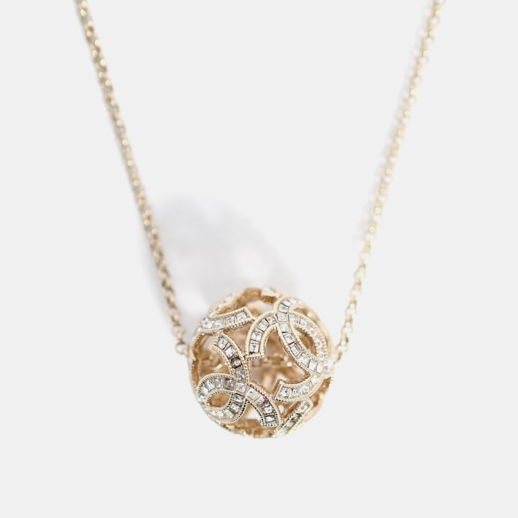 Chanel Gold Tone Baguette Crystal CC Ball Pendant Necklace Chanel Gold Tone Baguette Crystal CC Ball Pendant Necklace