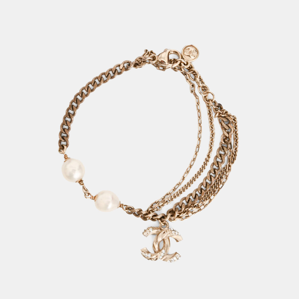 Chanel 2012 Gold Tone Metal/Faux Pearl CC Bracelet Chanel 2012 Gold Tone Metal/Faux Pearl CC Bracelet