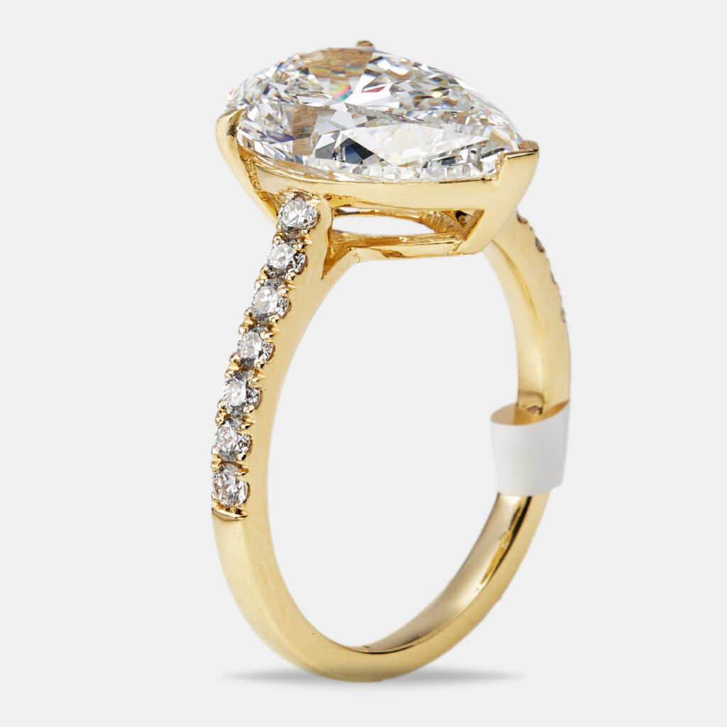 4.3 cts Pear and Round Lab Grown Diamond 18k Yellow Gold Ring Size 52 4.3 cts Pear and Round Lab Grown Diamond 18k Yellow Gold Ring Size 52